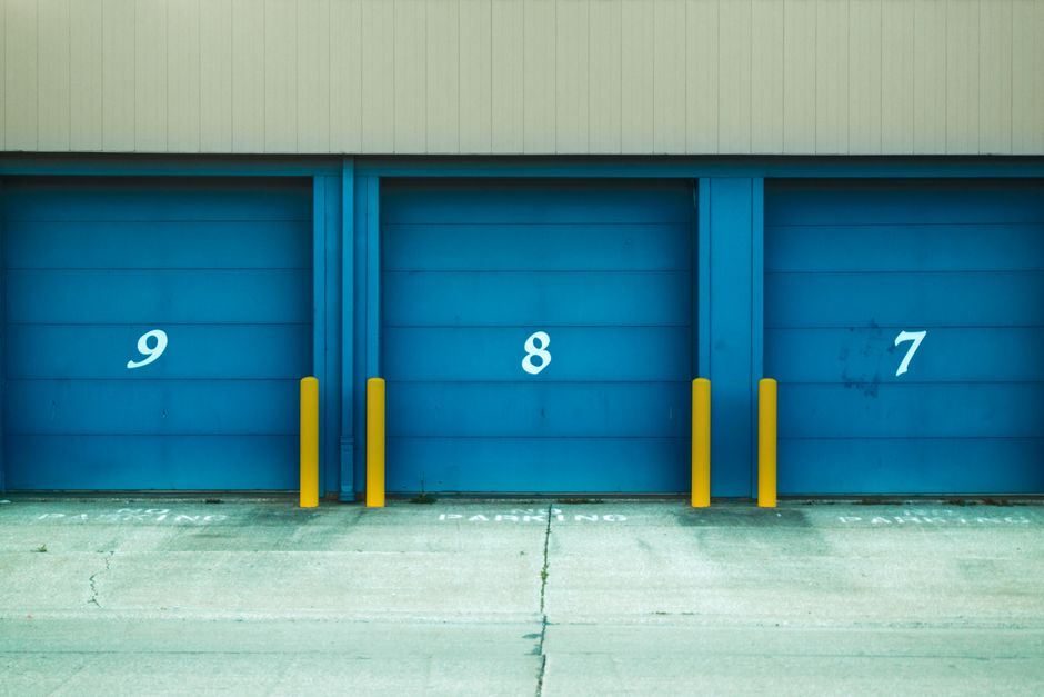 Numbered roller doors at a rented parking row