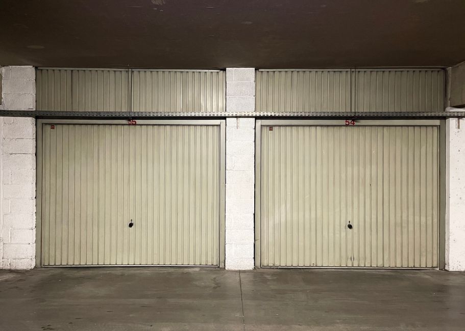 Pair of numbered rented garages in a parking level