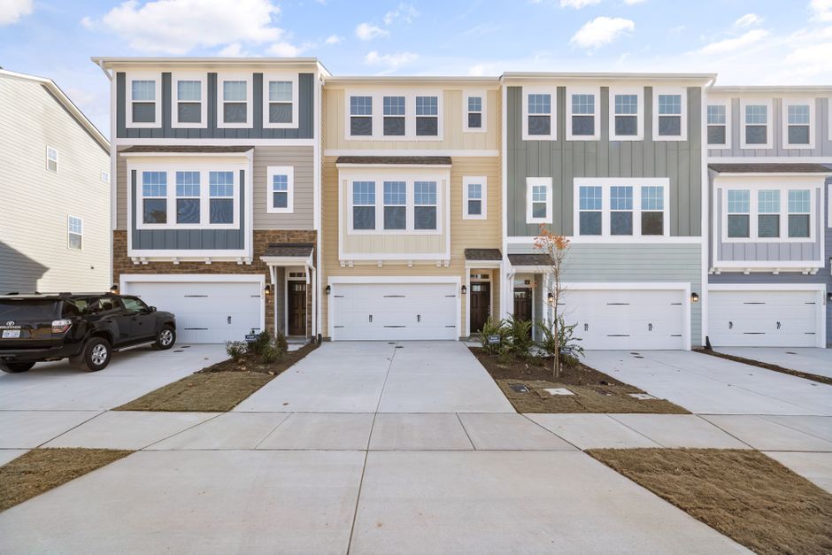 Modern townhouses with garages and private driveways